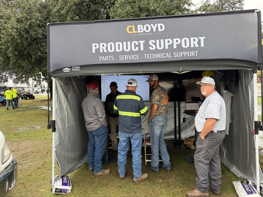 The CL Boyd product support tent at Demo Day with parts, service and technical support staff and customers